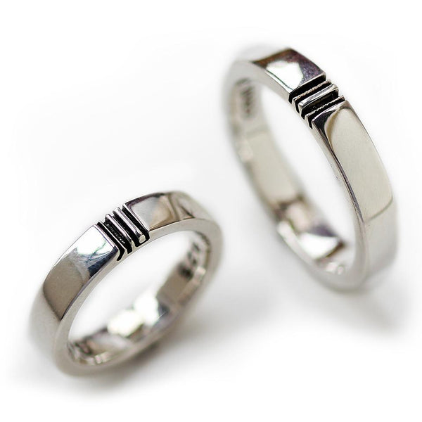 silver promise ring set engraved with initials filled with diamonds