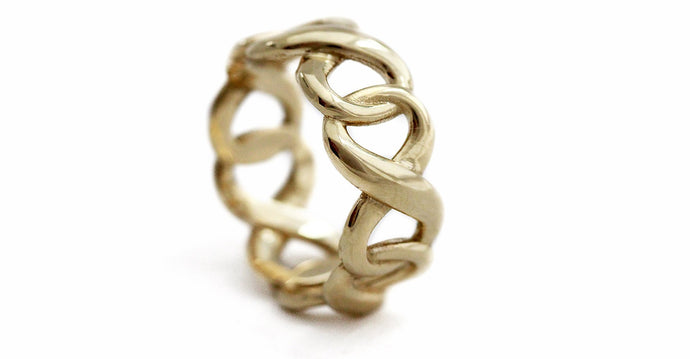 Wedding gold ring with wider infinity